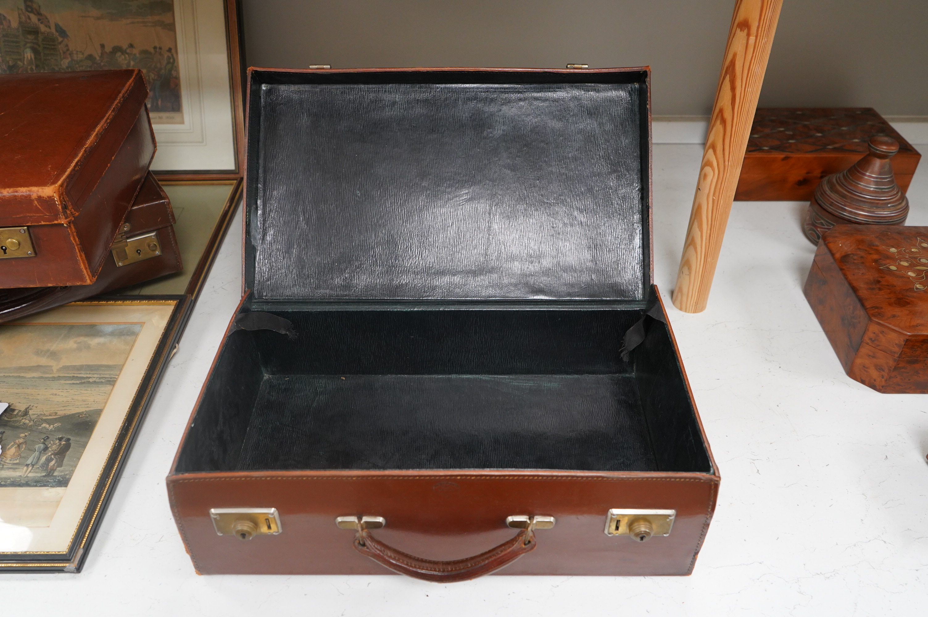 Three small vintage leather cases, largest 45cm wide